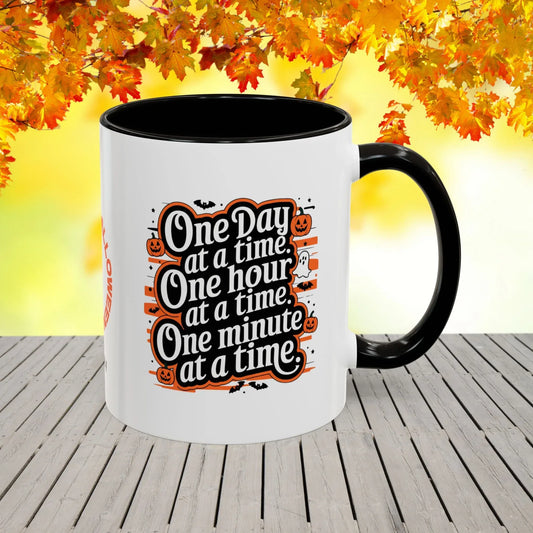 Shop our one day at a time halloween affirmation mug featuring the 11oz style option from MySisterIsASurvivor.