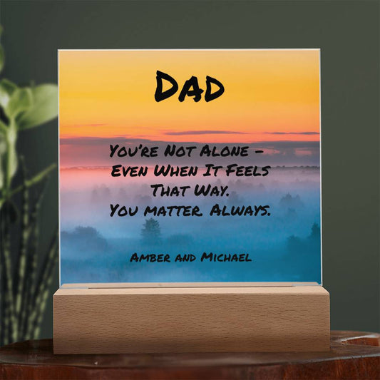 Encouraging message plaque reading “You’re Not Alone,” mental health support gift for fathers.