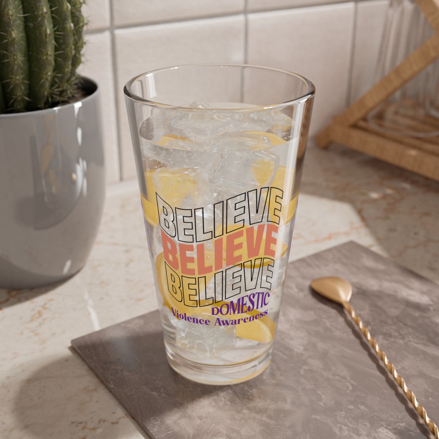 Pint glass with Believe Believe Believe and purple ribbon design for DV awareness