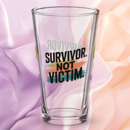 Survivor Not Victim pint glass, empowering quote design, trauma recovery awareness gift