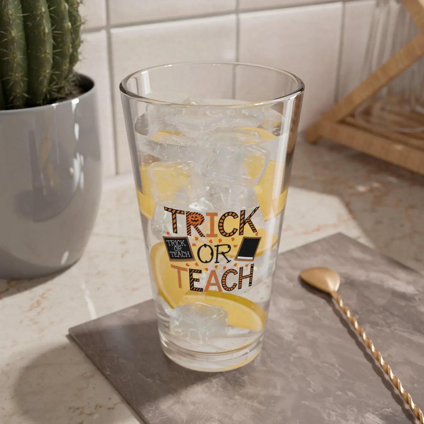 Shop our premium trick or teach halloween pint glass 16oz 1 from MySisterIsASurvivor.
