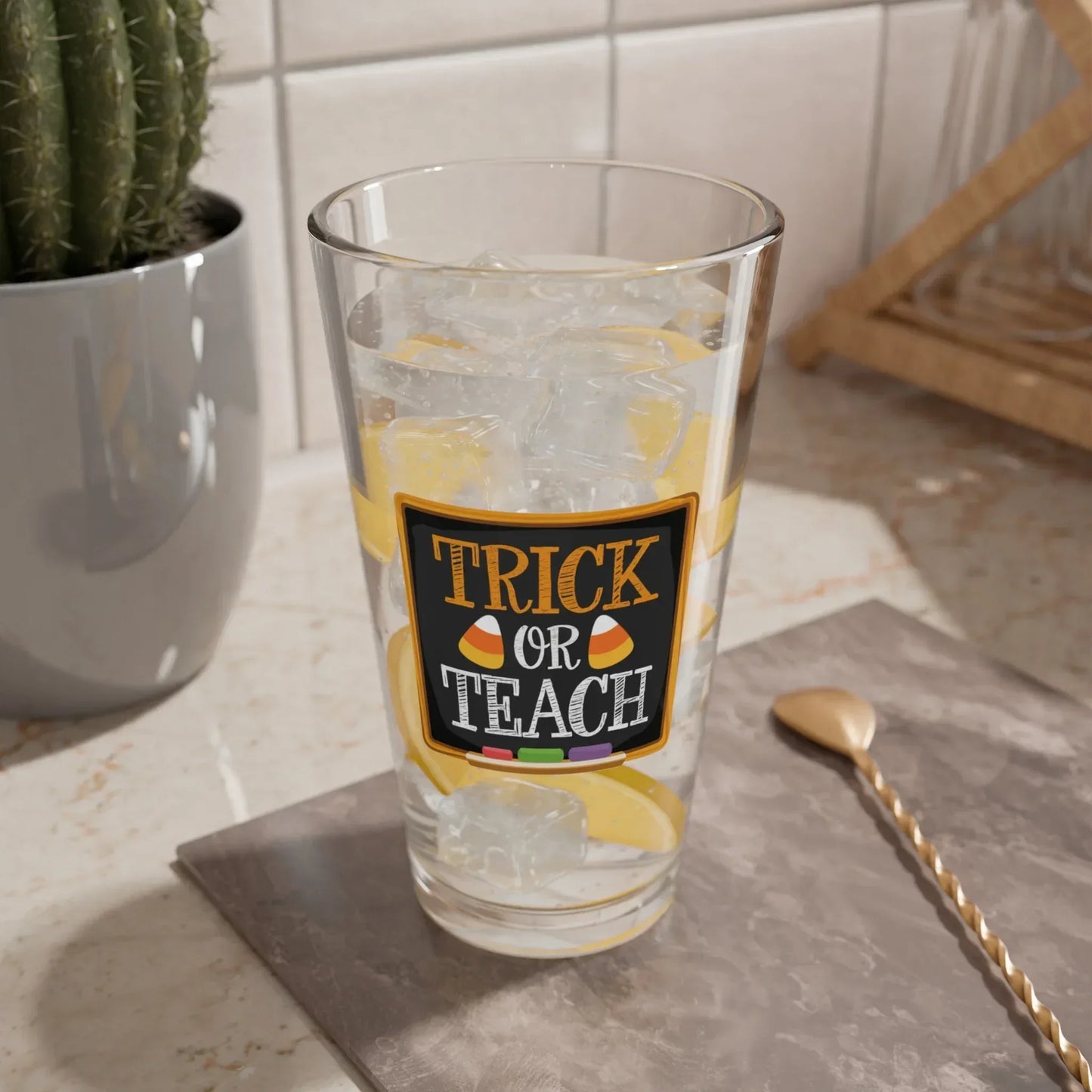 Shop our premium trick or teach halloween pint glass 16oz from MySisterIsASurvivor.