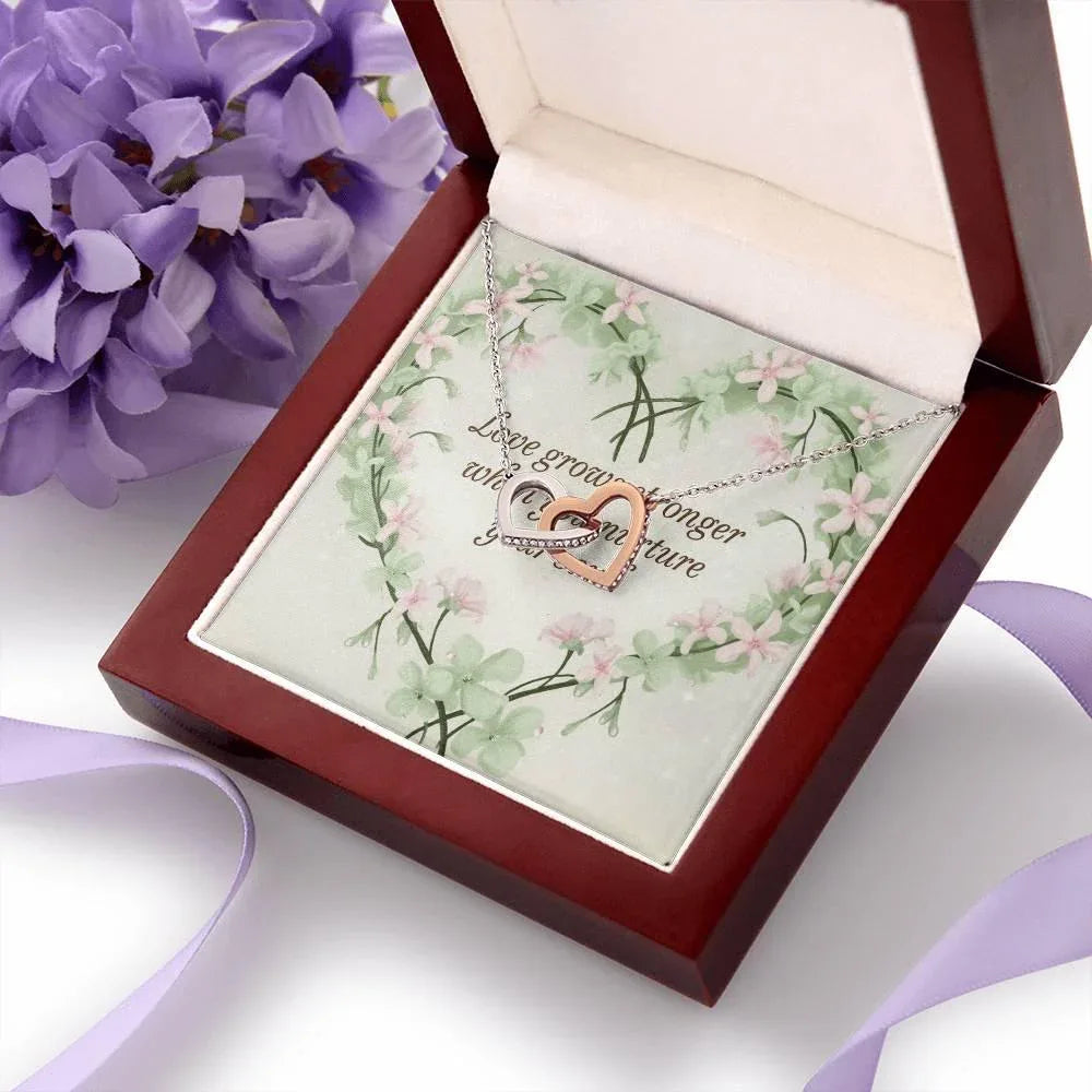 Shop our premium love grows stronger interlocking hearts necklace from MySisterIsASurvivor.