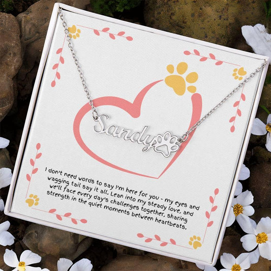 Personalized paw print necklace with custom name, symbolizing a dog’s quiet love and the promise to face challenges together.