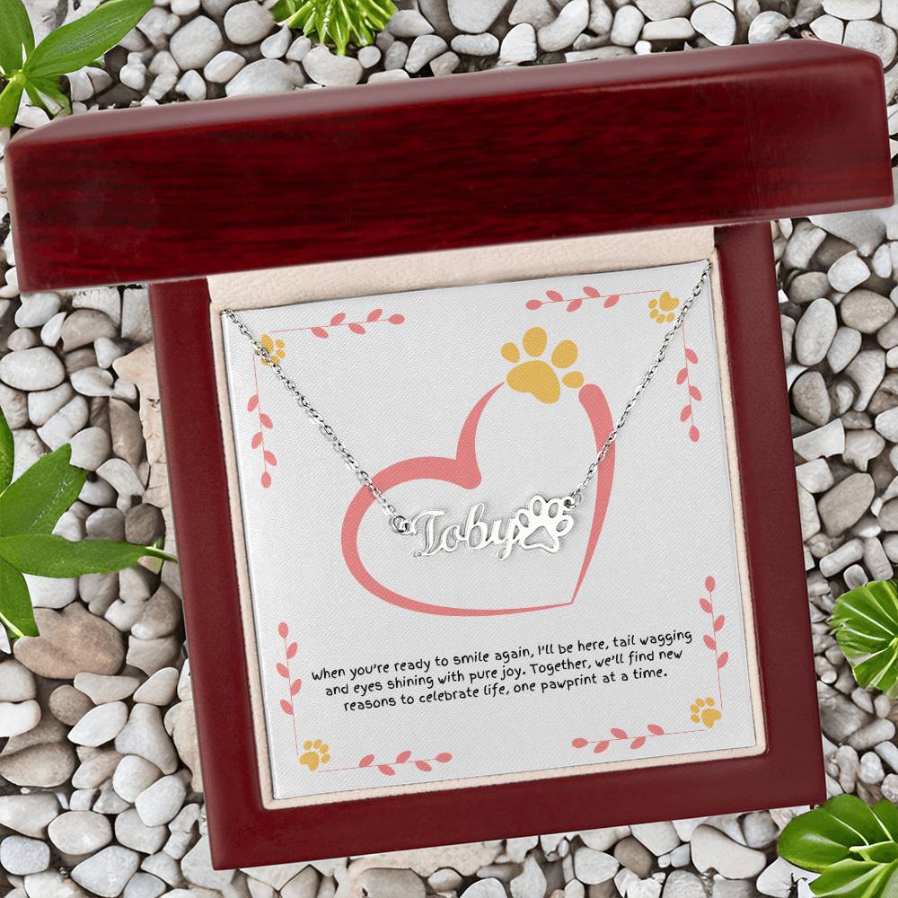 Custom paw print name necklace for dog moms, a reminder of companionship, comfort, and the healing power of paws.