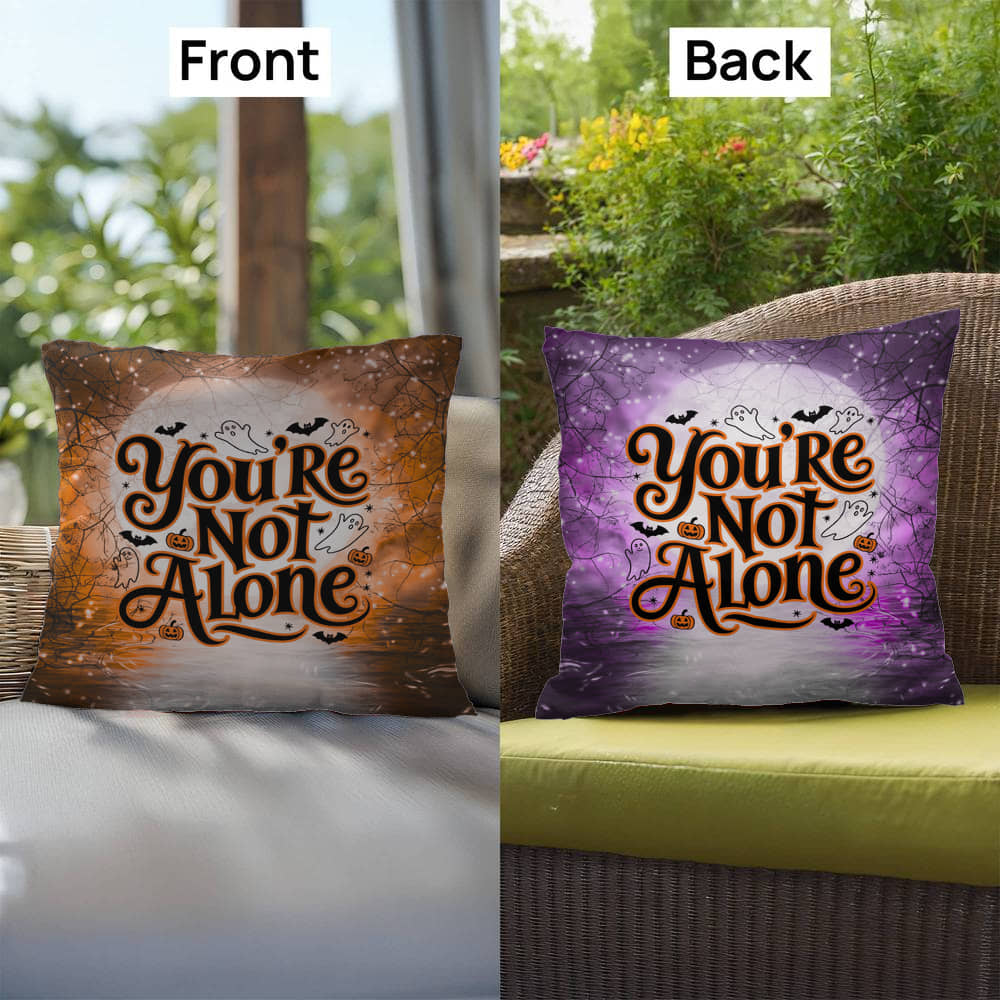 Indoor/outdoor mental health pillow with āYouāre Not Aloneā to promote comfort and support