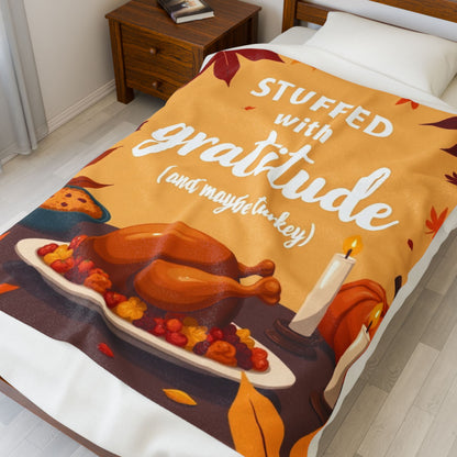 Funny Thanksgiving blanket with “Stuffed with Gratitude (and Maybe Turkey),” warm festive fall design.