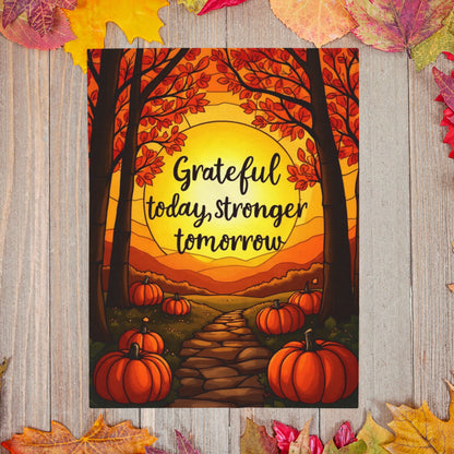 Motivational blanket with “Grateful Today, Stronger Tomorrow,” positive fall mindfulness message.
