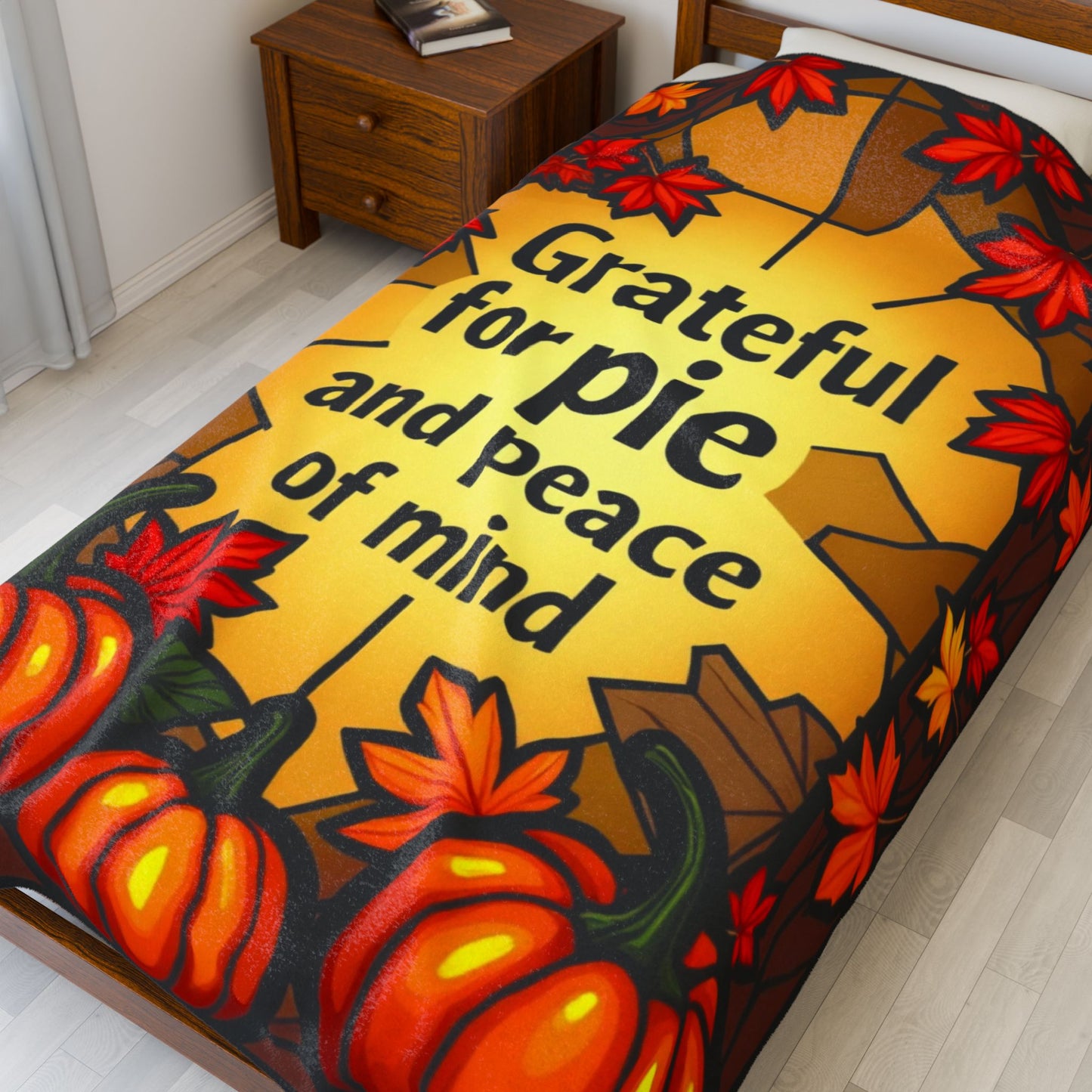 Thanksgiving blanket with “Grateful for Pie and Peace of Mind,” cheerful fall colors and cozy pie art.