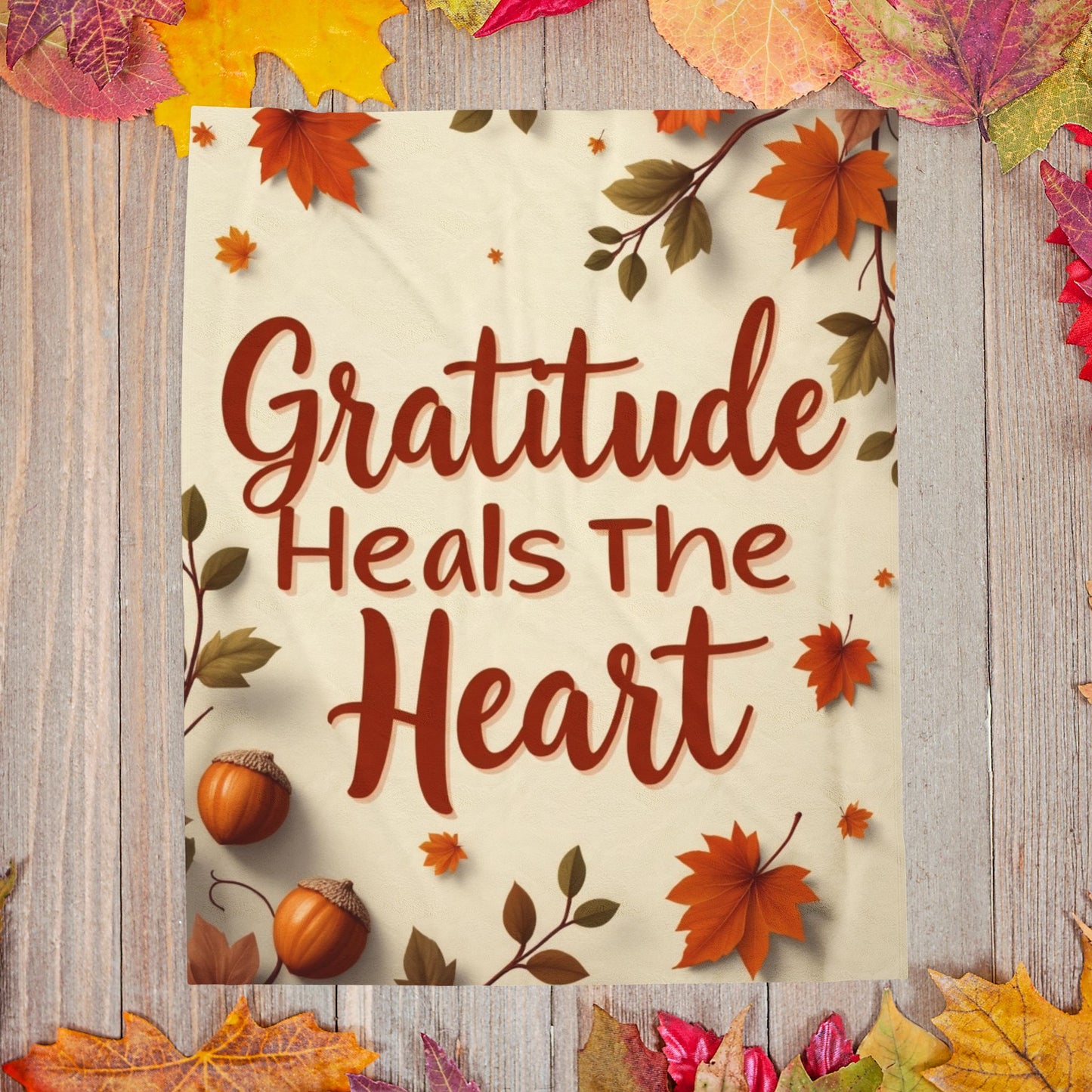Cozy blanket reading “Gratitude Heals the Heart,” autumn mindfulness design promoting warmth and peace.