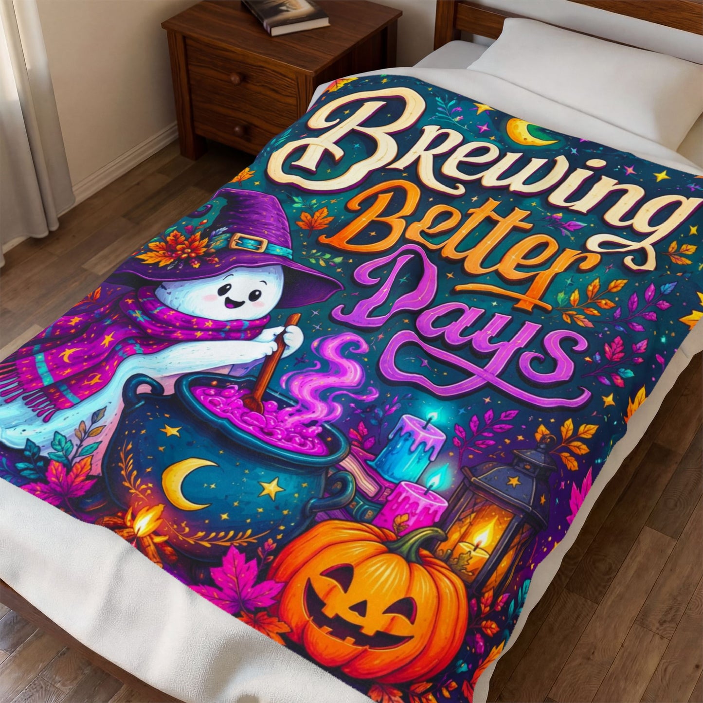 A colorful Halloween-themed blanket on a bed in a bedroom, featuring a printed blanket with the phrase 'Brewing Better Days' and a whimsical witch, cauldron, pumpkin, and lantern design.