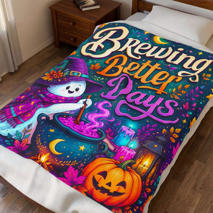 A colorful Halloween-themed blanket on a bed in a bedroom, featuring a printed blanket with the phrase 'Brewing Better Days' and a whimsical witch, cauldron, pumpkin, and lantern design.