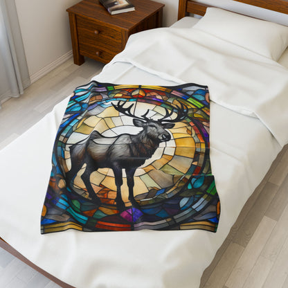A reindeer blanket with stained glass-style art that adds warmth and festive woodland flair.
