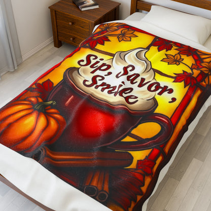 Cozy fall blanket with “Sip, Savor, Smile,” warm orange tones and autumn mindfulness aesthetic.