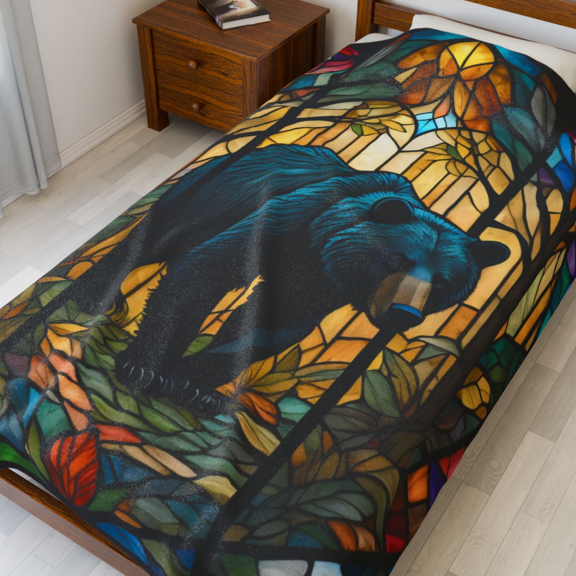 A cozy stained glass bear blanket featuring vibrant wildlife art for warmth and relaxation.