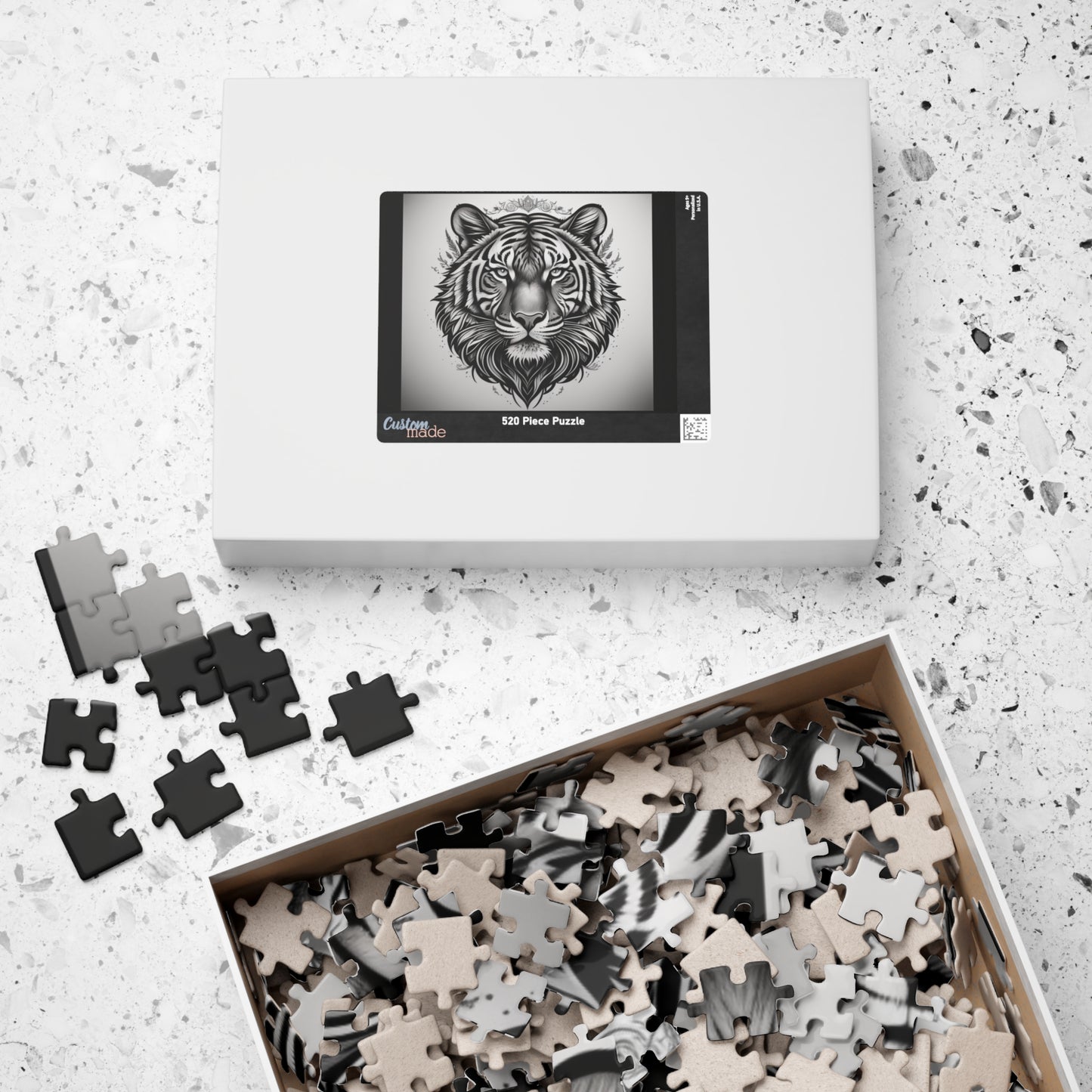 Jigsaw puzzle set with a tiger design on a speckled surface