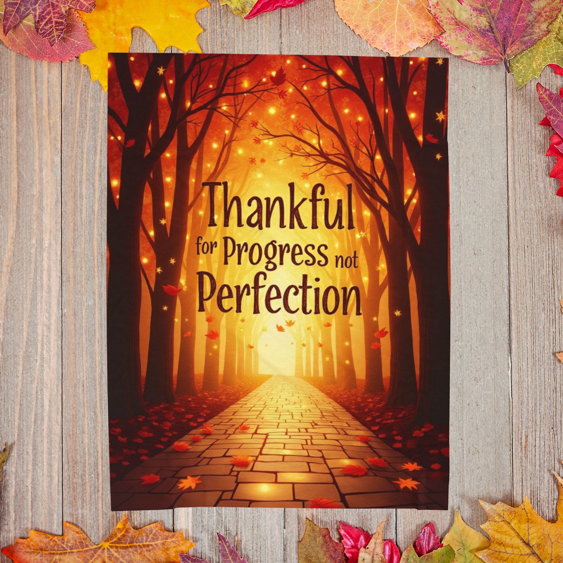 Mindful motivation blanket with “Thankful for Progress, Not Perfection,” calming fall color palette.