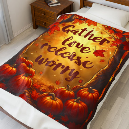 Cozy blanket with “Gather Love, Release Worry,” peaceful fall-themed design promoting calm and gratitude.