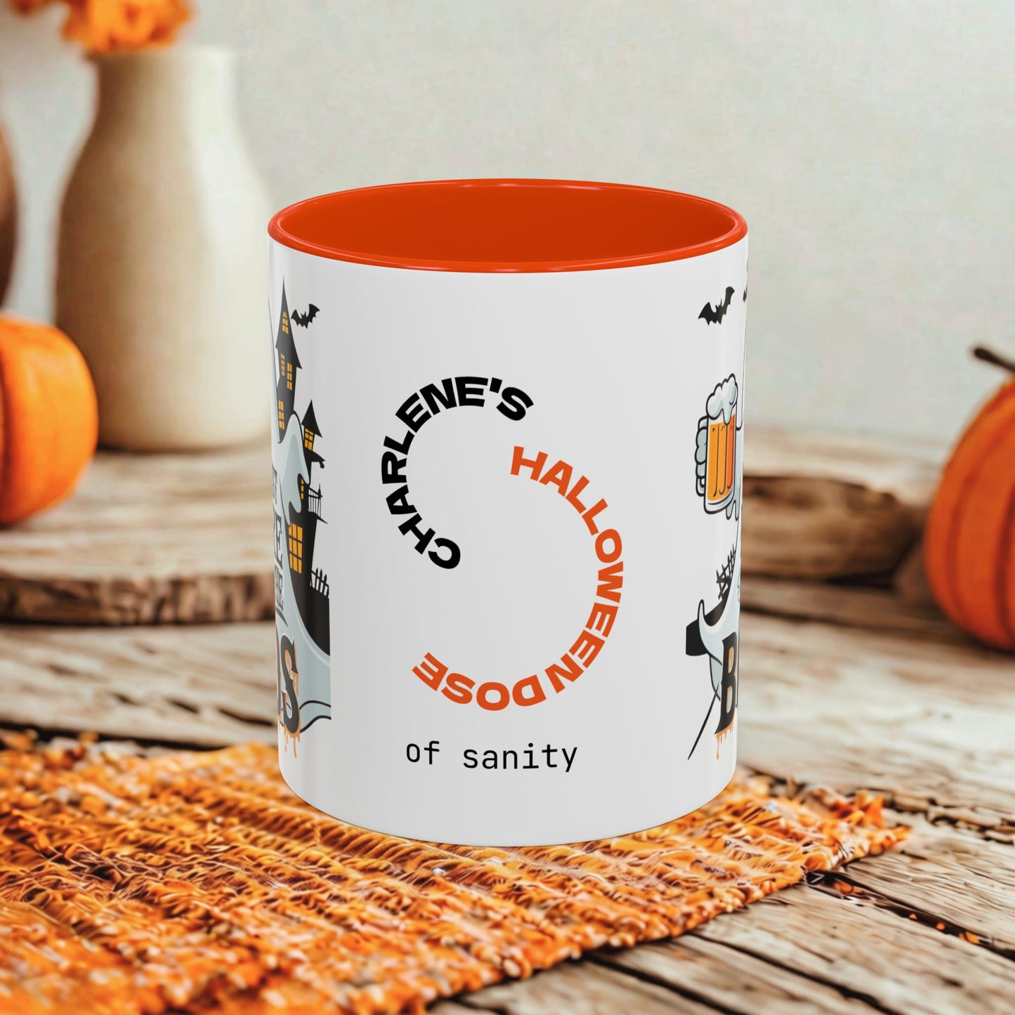 A white ceramic mug with a bright orange interior and orange printed text reading 'Charlene's Halloween Dose of sanity,' styled on a rustic wooden surface with pumpkins and a woven mat in the background.