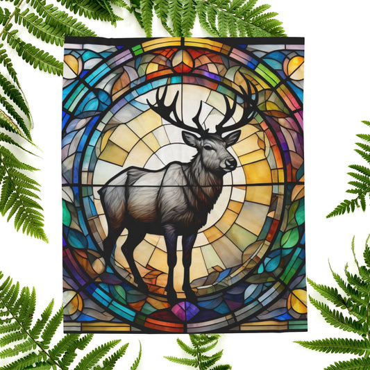 A reindeer blanket with stained glass-style art that adds warmth and festive woodland flair.