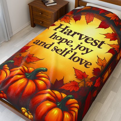 Inspirational blanket with “Harvest Hope, Joy, and Self-Love,” cozy Thanksgiving mindfulness design.