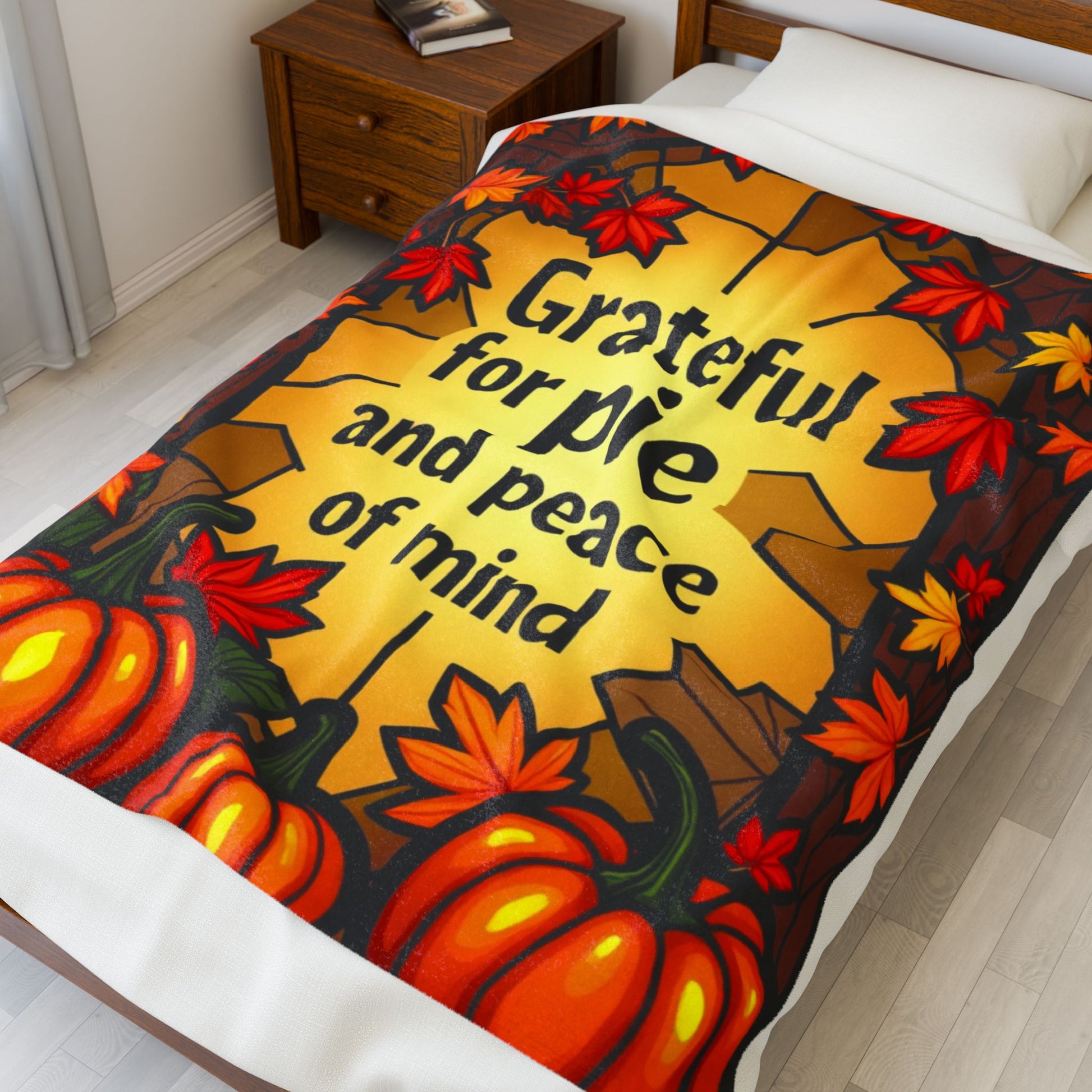 Thanksgiving blanket with “Grateful for Pie and Peace of Mind,” cheerful fall colors and cozy pie art.