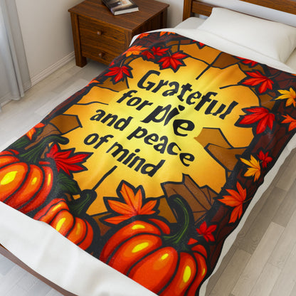Thanksgiving blanket with “Grateful for Pie and Peace of Mind,” cheerful fall colors and cozy pie art.