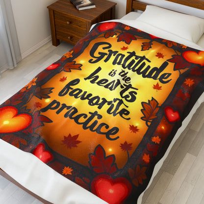Mindful fall blanket with “Gratitude Is the Heart’s Favorite Practice,” warm calming tones and fall décor.