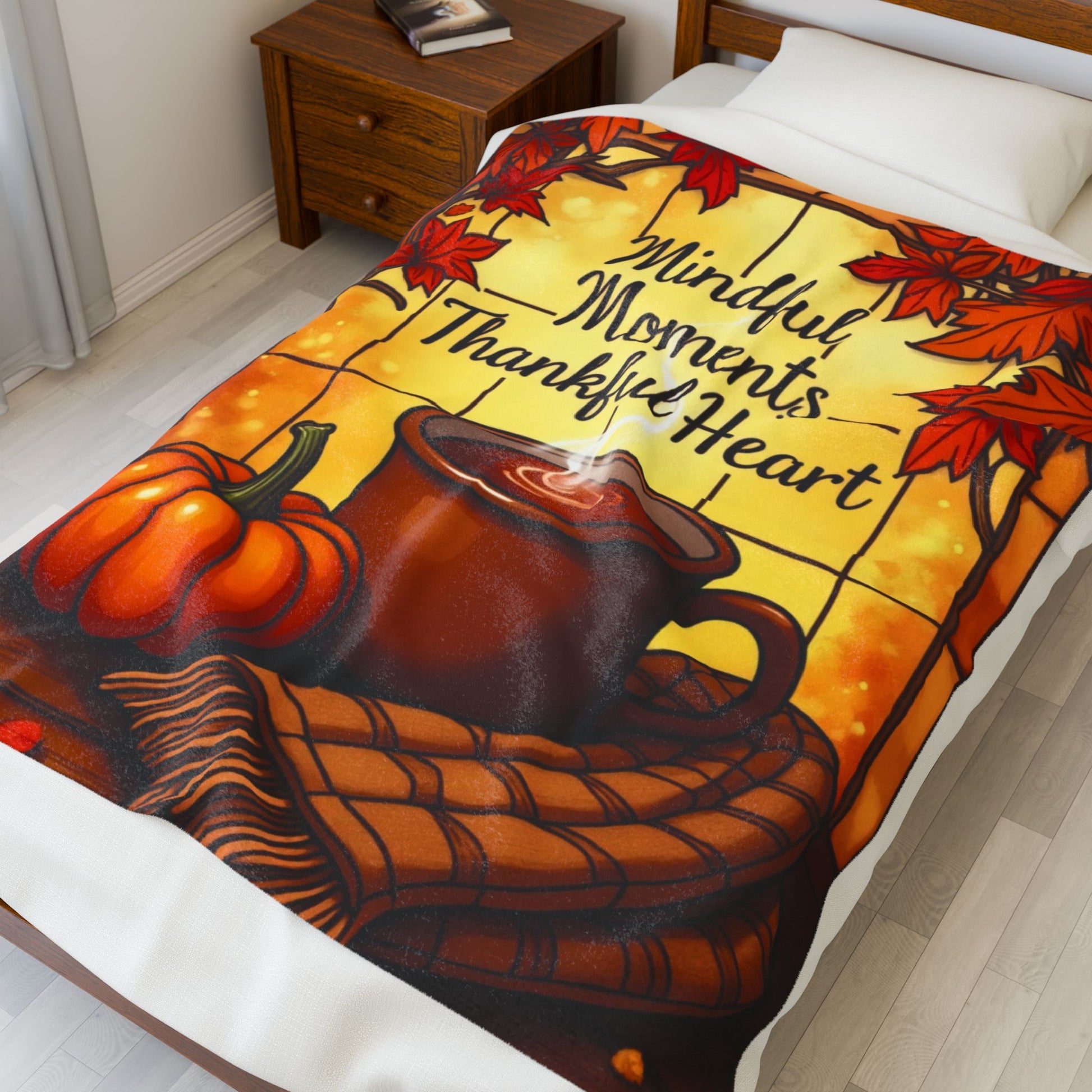 Cozy blanket with “Mindful Moments, Thankful Heart,” autumn mindfulness theme in warm orange and red.