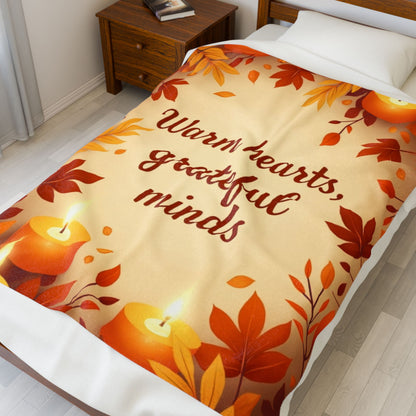 Cozy fall blanket with “Warm Hearts, Grateful Minds,” mindfulness-inspired autumn home décor.