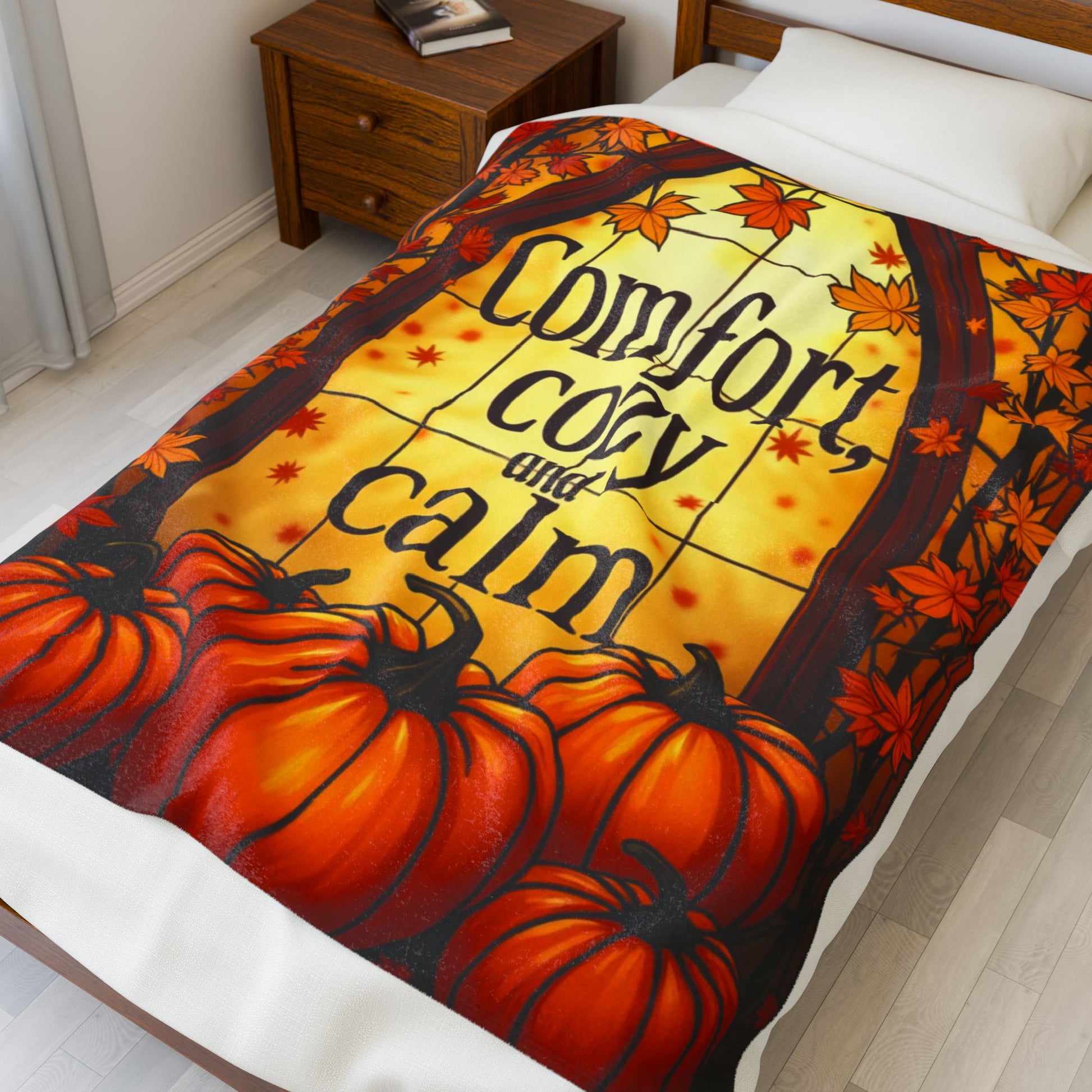 Velveteen blanket reading “Comfort, Cozy, and Calm,” relaxing fall self-care design in soft warm tones.