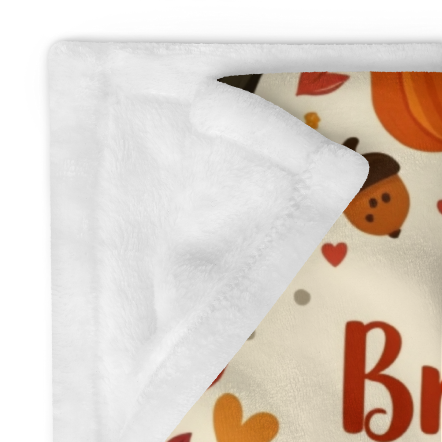 Cozy blanket with “Breathe, Give Thanks, Repeat,” autumn mindfulness theme in orange and gold hues.