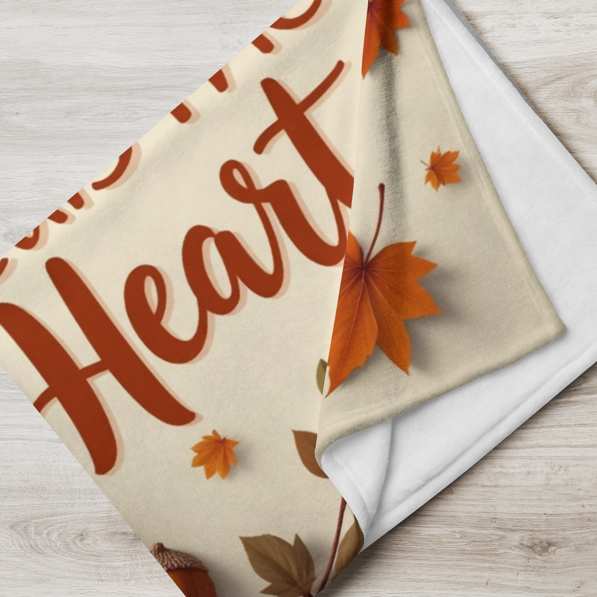 Cozy blanket reading “Gratitude Heals the Heart,” autumn mindfulness design promoting warmth and peace.