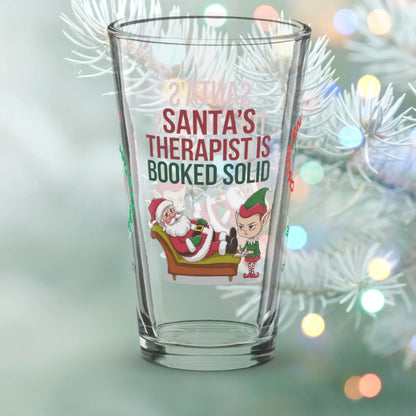 Shop our santas therapist is booked solid christmas pint glass 1 featuring the 16oz style option from MySisterIsASurvivor.