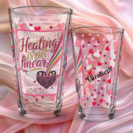 Shop our healing is not linear valentines day pint glass featuring the 16oz style option from MySisterIsASurvivor.