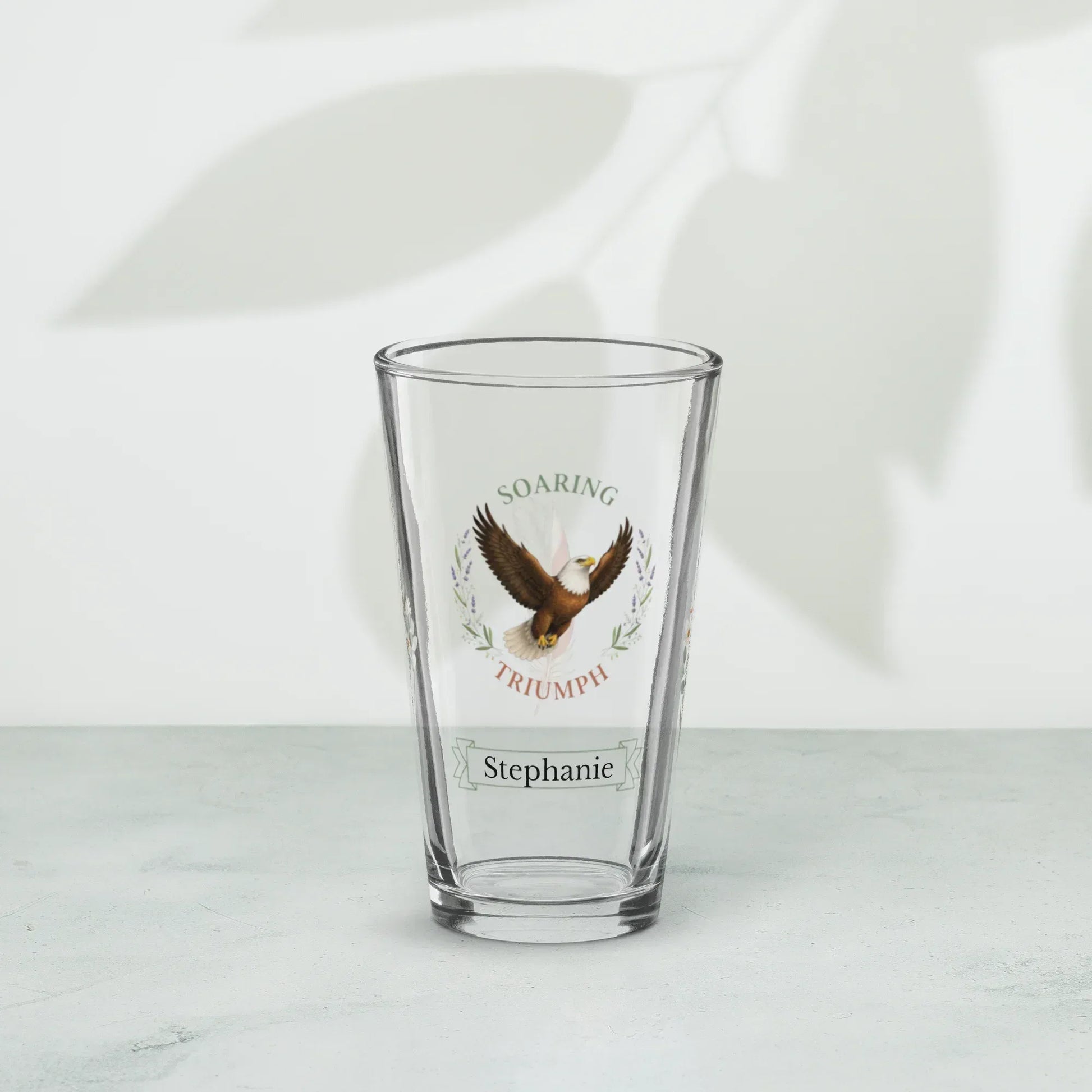 Shop our premium soaring triumph eagle pint glass from MySisterIsASurvivor.
