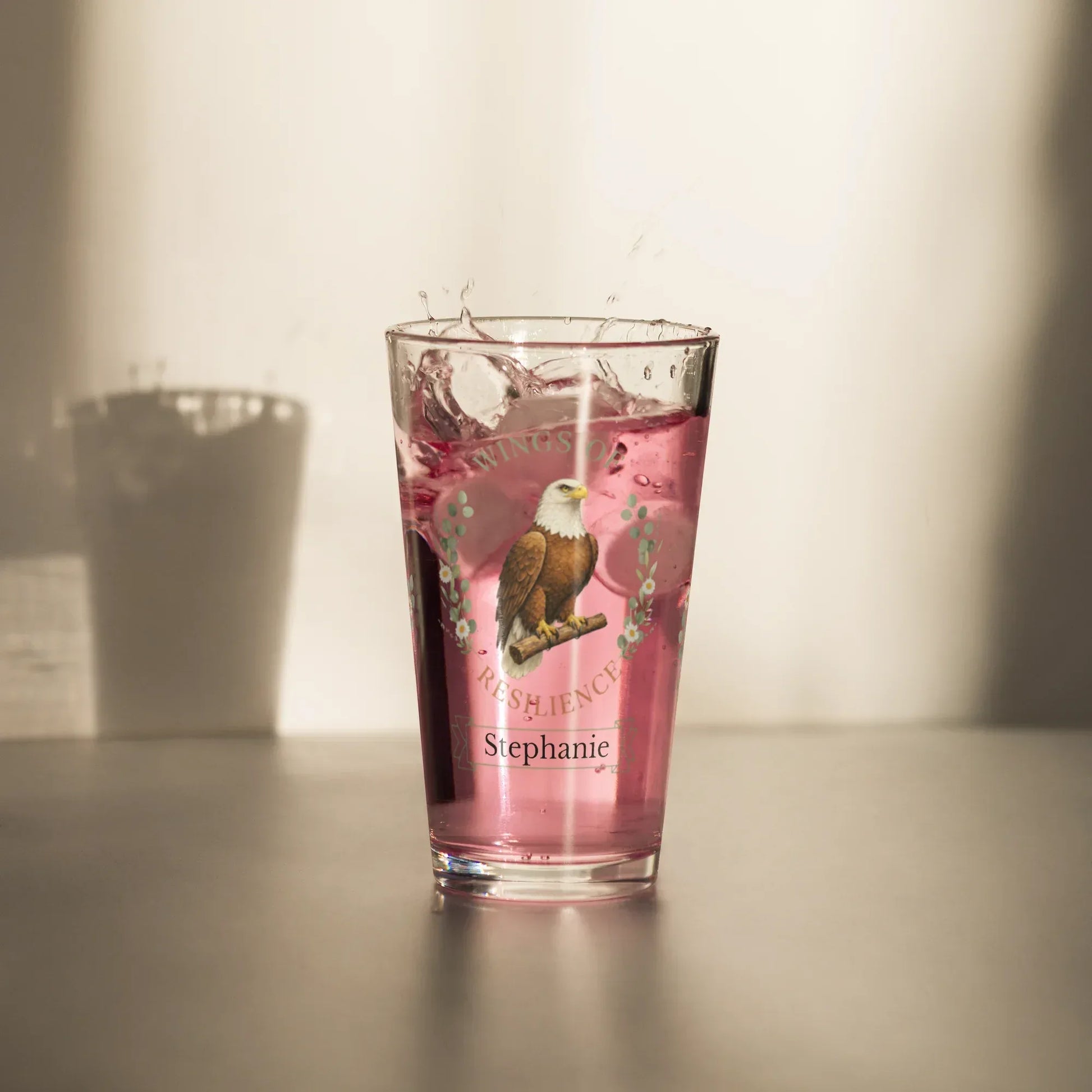 Shop our premium wings of resilience eagle pint glass from MySisterIsASurvivor.