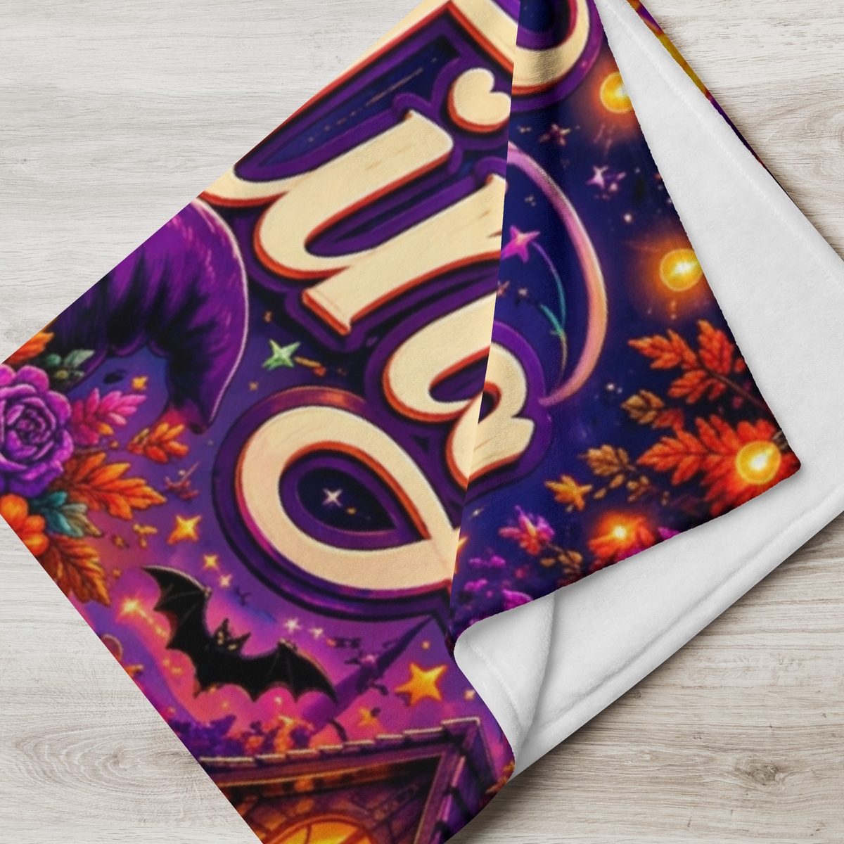A rectangular Halloween-themed blanket displayed against a light wood plank background. The artwork features the words 'Ghosting Negative Vibes' in large decorative lettering, with a cartoon ghost wearing a witch hat and sunglasses, surrounded by pumpkins, a moonlit sky, a house, and lanterns.