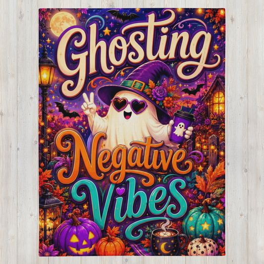A rectangular Halloween-themed blanket displayed against a light wood plank background. The artwork features the words 'Ghosting Negative Vibes' in large decorative lettering, with a cartoon ghost wearing a witch hat and sunglasses, surrounded by pumpkins, a moonlit sky, a house, and lanterns.