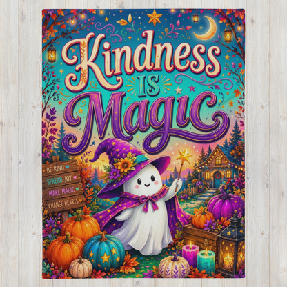 A Halloween blanket featuring the phrase “Kindness is Magic” in large stylized lettering above a whimsical Halloween scene. The artwork shows a smiling white ghost in a purple witch hat and cape, surrounded by pumpkins, candles, lanterns, autumn leaves, and a cozy house.