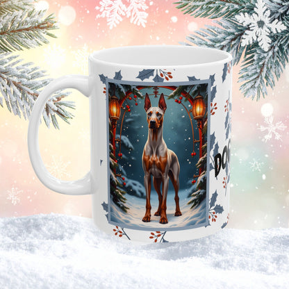 Doberman (Fawn & Rust) Winter Mug - fawn and rust Doberman illustrated in a bright winter scene with frosted pine branches