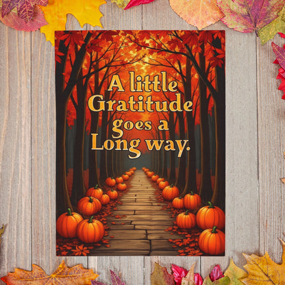 Soft fall blanket with quote “A Little Gratitude Goes a Long Way,” cozy autumn mindfulness design in warm tones.