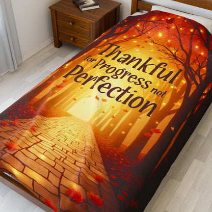 Mindful motivation blanket with “Thankful for Progress, Not Perfection,” calming fall color palette.