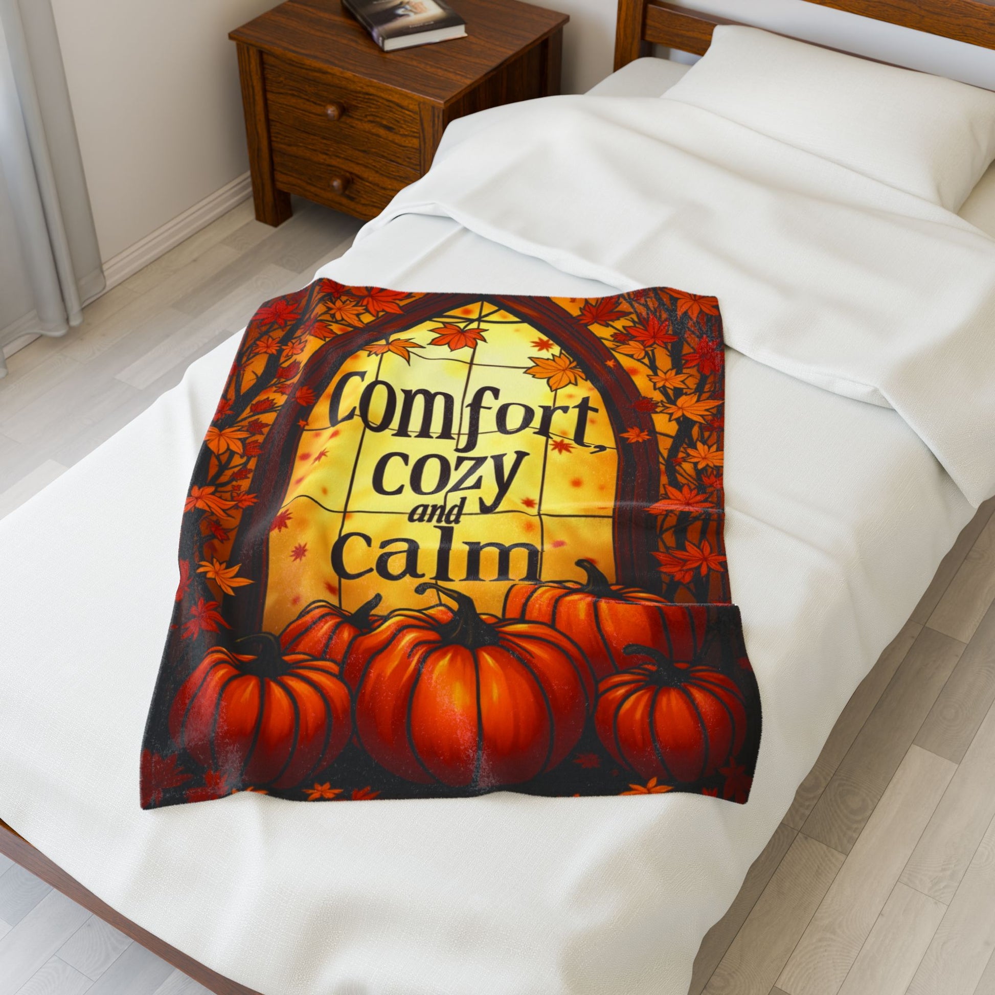 Velveteen blanket reading “Comfort, Cozy, and Calm,” relaxing fall self-care design in soft warm tones.