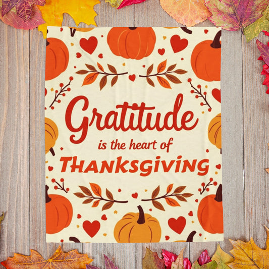 Thanksgiving blanket with “Gratitude Is the Heart of Thanksgiving,” cozy seasonal gratitude design.
