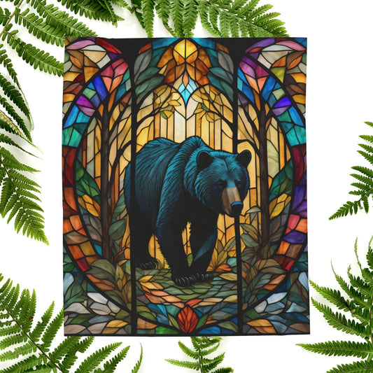 A cozy stained glass bear blanket featuring vibrant wildlife art for warmth and relaxation.