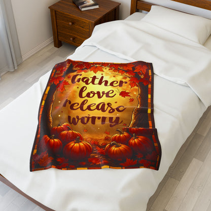 Cozy blanket with “Gather Love, Release Worry,” peaceful fall-themed design promoting calm and gratitude.
