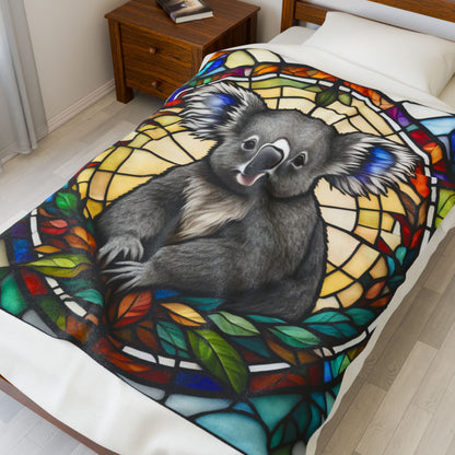 A cute koala blanket with stained glass-style art, perfect for cozy comfort and self-care.
