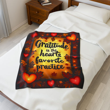 Mindful fall blanket with “Gratitude Is the Heart’s Favorite Practice,” warm calming tones and fall décor.