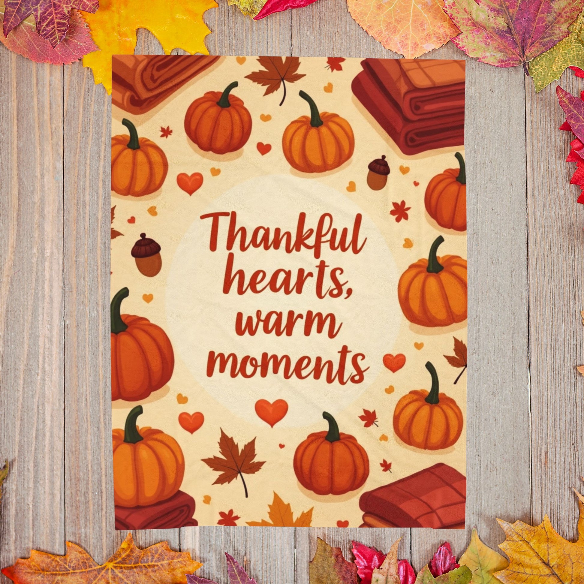 Thanksgiving blanket reading “Thankful Hearts, Warm Moments,” cozy autumn gratitude design.